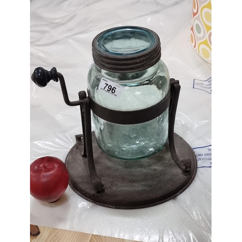 796 - A large aqua blue glass butter churn with an Atlas mason jar, set into a cast metal holder with hand... 