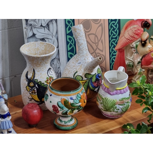 832 - Four ceramic items including two matching hand thrown pieces in a Spanish design consisting of a vas... 