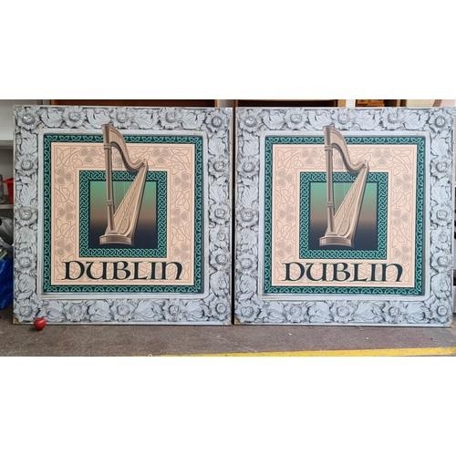 834 - Two very large, very heavy wall plaques depicting the Irish harp allowing with text reading 