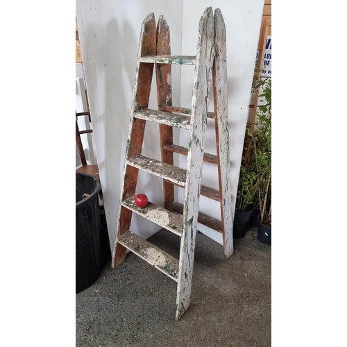 848 - A vintage wooden A-frame step ladder with 5 steps. The paint gives it a nice effect. Height to top s... 