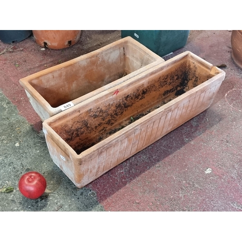 849 - Two terracotta box planters.