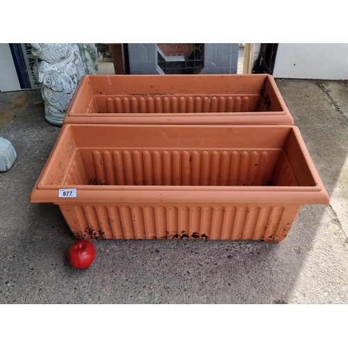 877 - A duo of good sized rectangular box planters.