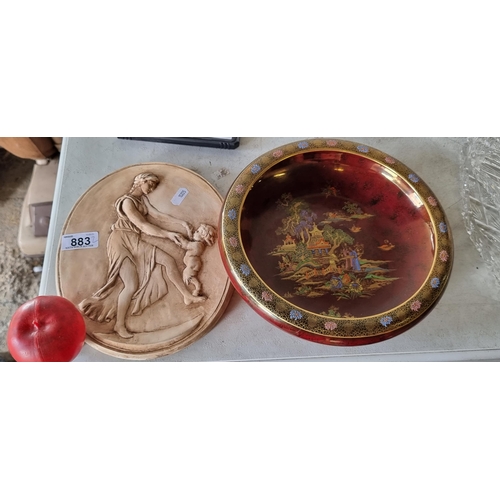 883 - Two items including a Crown Devon Chinoiserie bowl in a red lustre with pagona scene with hand paint... 