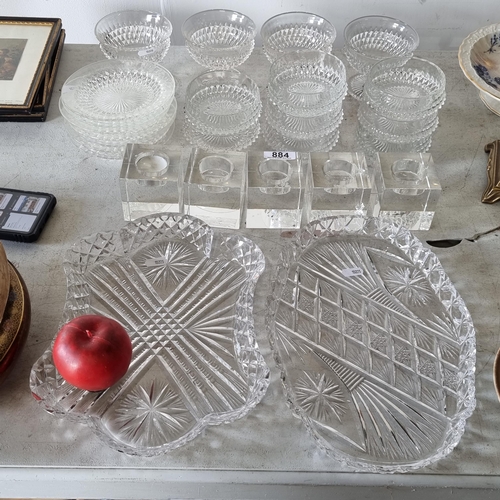 884 - Twenty-six cut glass items including two serving dishes, five tealight holders, four stemmed dessert... 