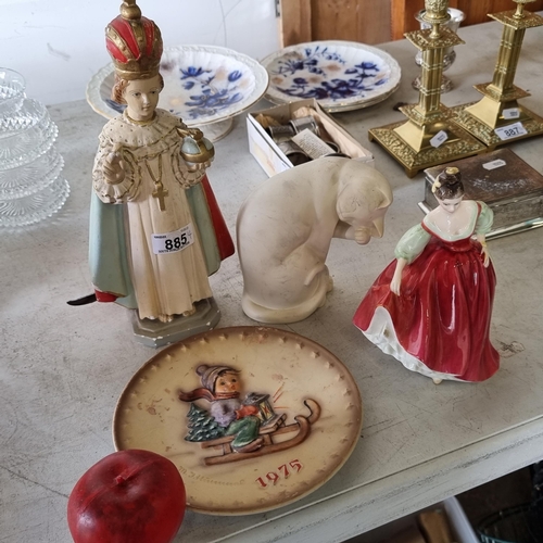 885 - Four porcelain items including a Hummel 1975 5th annual plate, a child of prague, a Royal Doulton Fa... 