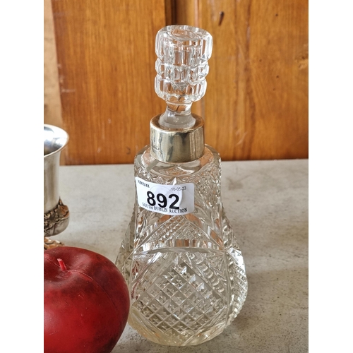 892 - An antique cut crystal perfume bottle with sterling silver collar and cut crystal stopper. Hallmarke... 