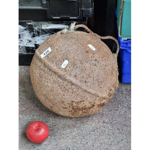 926 - An antique buoy with two handles to top. Although very heavy, the hollow interior would cause the bu... 