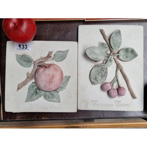 933 - Two charming Italian made ceramic wall plaques featuring high relief fruit including a 'Malum Mali' ... 