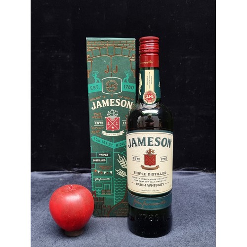 599 - A sealed 70cl bottle of John Jameson & son triple distilled Irish Whiskey with original box.