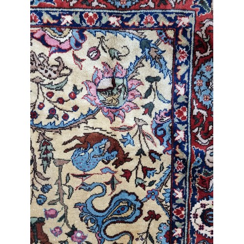 867 - Star lot : A fabulous hand knotted, hand finished thick pile wool rug in a Persian pattern in red, c... 