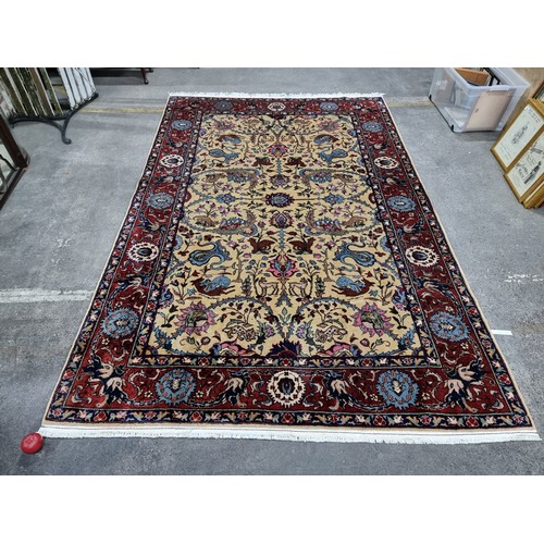 867 - Star lot : A fabulous hand knotted, hand finished thick pile wool rug in a Persian pattern in red, c... 