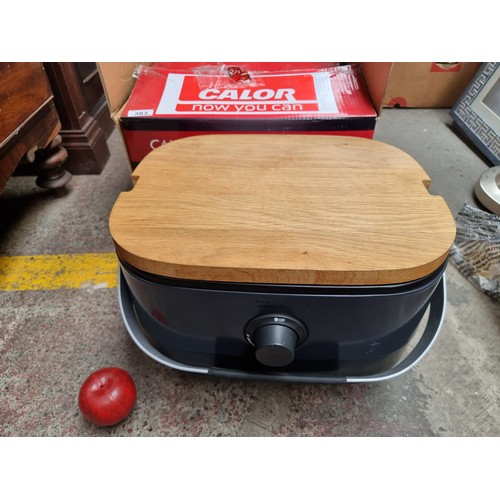 383 - A Calor Mini-BBQ with gas connections, chopping board and super lightweight grill for outdoor cookin... 