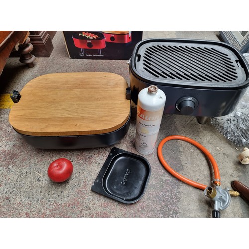 383 - A Calor Mini-BBQ with gas connections, chopping board and super lightweight grill for outdoor cookin... 