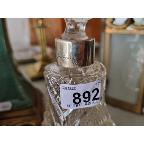 892 - An antique cut crystal perfume bottle with sterling silver collar and cut crystal stopper. Hallmarke... 