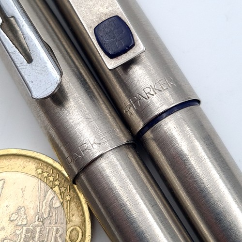 5 - Two vintage brushed chrome Parker ball point pens, featuring clean barrels.