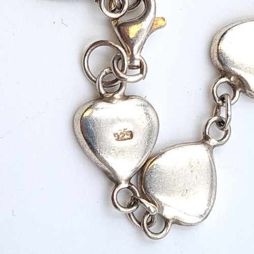 7 - Three hallmarked sterling silver love heart bracelets, in very pretty styles and designs with link s... 