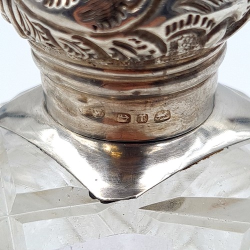 18 - A very large and heavy example of an antique Sterling silver screw topped perfume bottle, featuring ... 