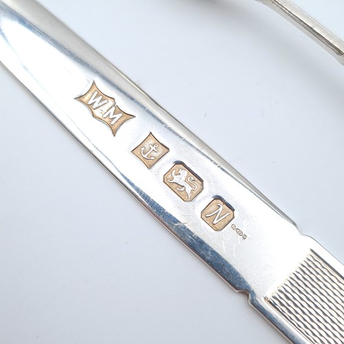 21 - A collection of two sterling silver items, comprising of a modern style letter opener. Hallmarked Bi... 