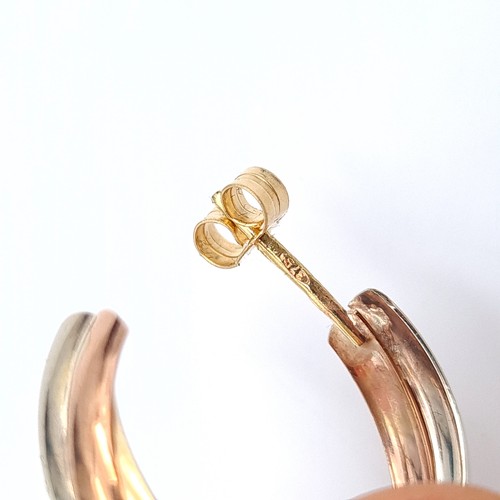 40 - A pretty pair of 9 carat gold bi-colour hooped earrings. Total weight: 2.9 grams. Encased in a gift ... 