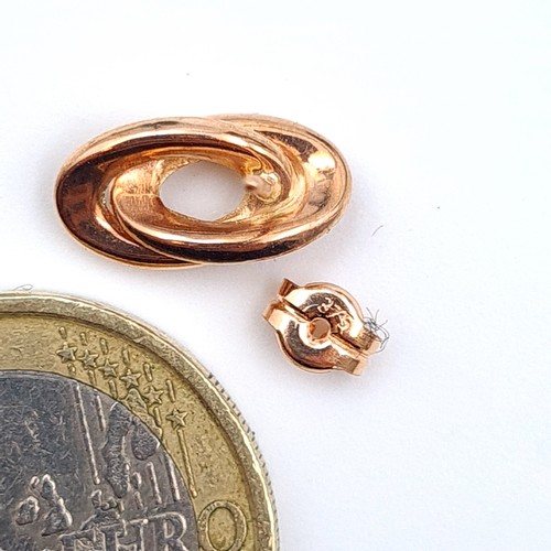 41 - A pair of as new twist mounted 9 carat gold earrings, set with stamped butterfly backs. Total weight... 