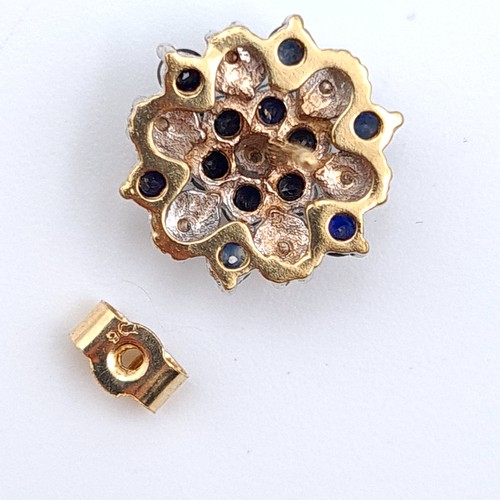 42 - Star Lot : A sparkling pair of 9 carat gold floral cluster Diamond and Sapphire stud earrings, these... 