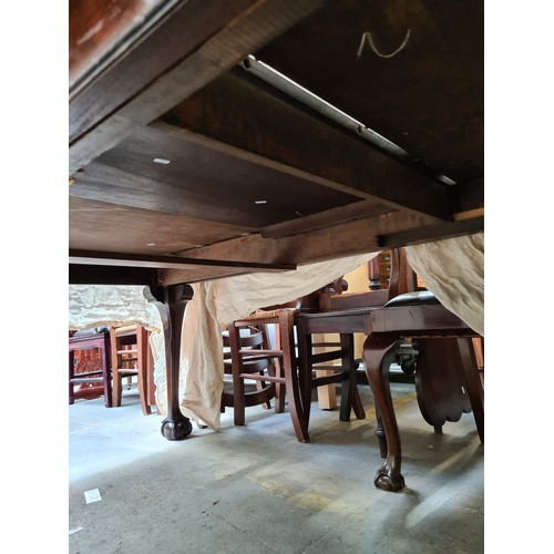 657 - Star Lot :  A beautiful antique Solid mahogany dining suite with a large extendable table along with... 