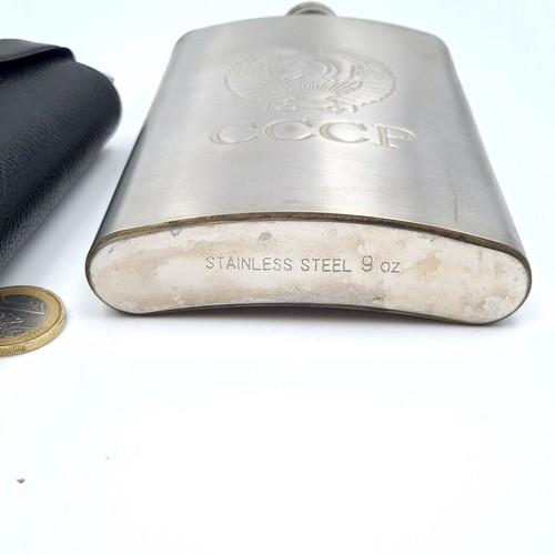 55 - A Russian stainless steel hip flask, set with Russian Cartouche emblem to front. Encased in a leateh... 