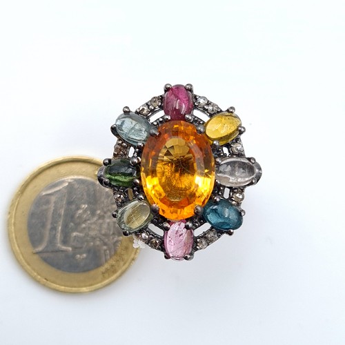 600 - Star Lot : A fabulous large dress ring with Sapphire, ruby, tourmaline, aquamarine etc featuring a b... 