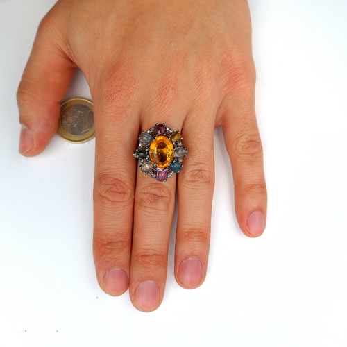 600 - Star Lot : A fabulous large dress ring with Sapphire, ruby, tourmaline, aquamarine etc featuring a b... 