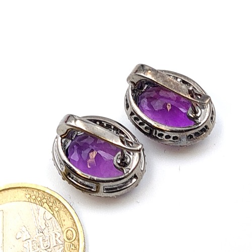 603 - Star lot : A beautiful suite of Amethyst and Diamond jewellery, which includes three stunningly larg... 