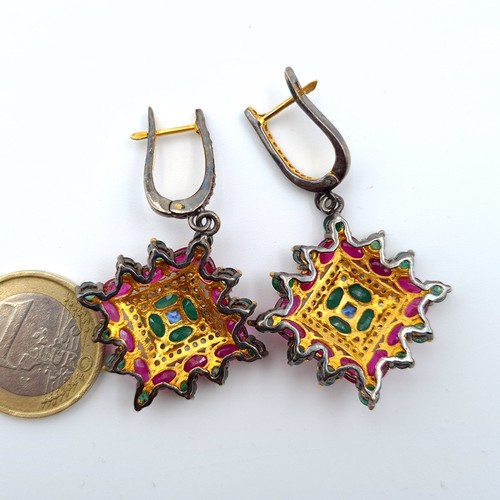 604 - Star Lot : A stunning pair of Indian inspired drop earrings, these amazing Emerald and Ruby earrings... 