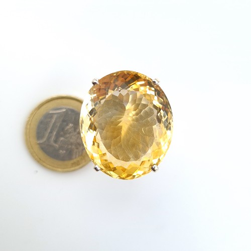 606 - A fabulous and huge natural Citrine cocktail ring, featuring a beautiful central facet cut 8 carat C... 