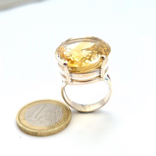 606 - A fabulous and huge natural Citrine cocktail ring, featuring a beautiful central facet cut 8 carat C... 