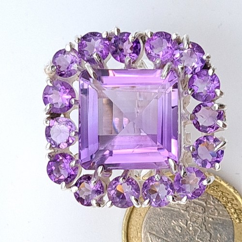 613 - Star Lot : An amazing huge natural Amethyst gem stone ring, this example showcases multiple large an... 