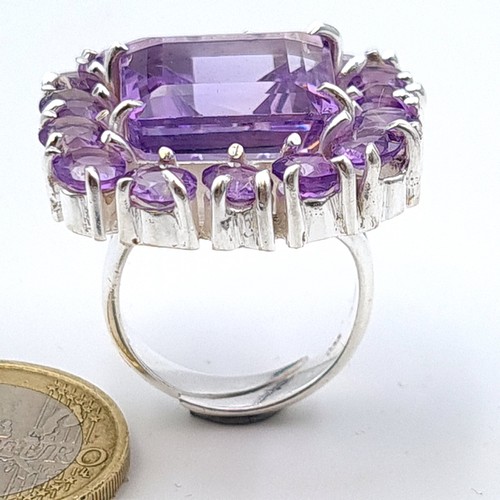 613 - Star Lot : An amazing huge natural Amethyst gem stone ring, this example showcases multiple large an... 