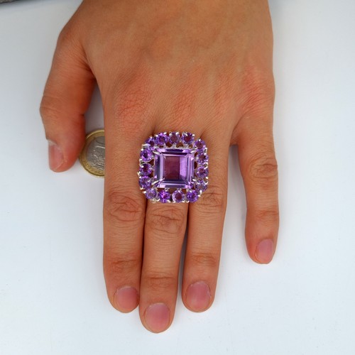 613 - Star Lot : An amazing huge natural Amethyst gem stone ring, this example showcases multiple large an... 