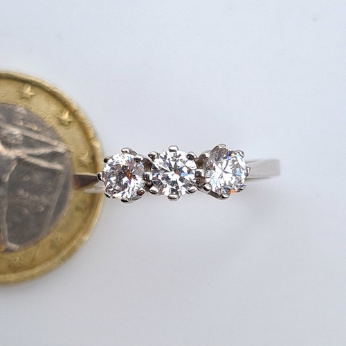 654 - Star Lot : A mesmerising three stone White Sapphire 9 carat White Gold ring. This ring features brig... 