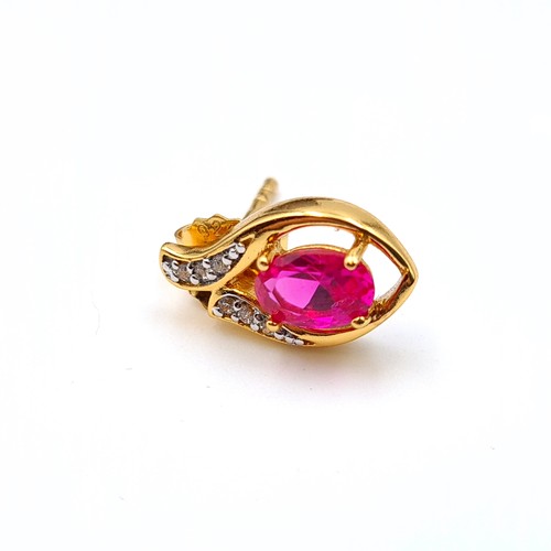 653 - A pair of natural Ruby and Sapphire 9 carat gold plated stud earrings. Old, new boxed stock.