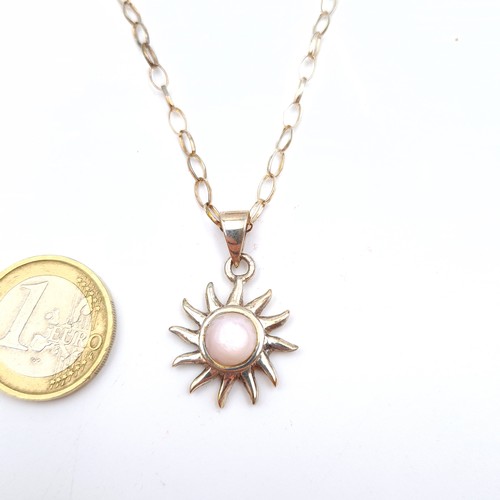 617 - An attractive polished opal sun burst sterling silver pendant and link chain. Length of chain: 44cm.... 