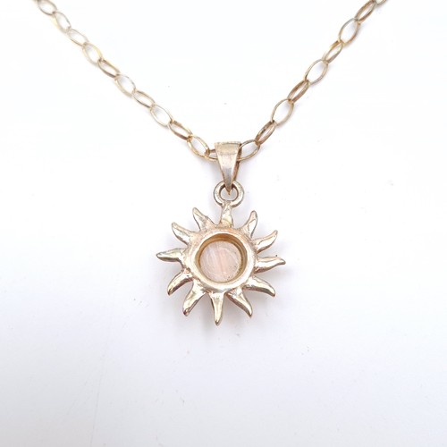 617 - An attractive polished opal sun burst sterling silver pendant and link chain. Length of chain: 44cm.... 