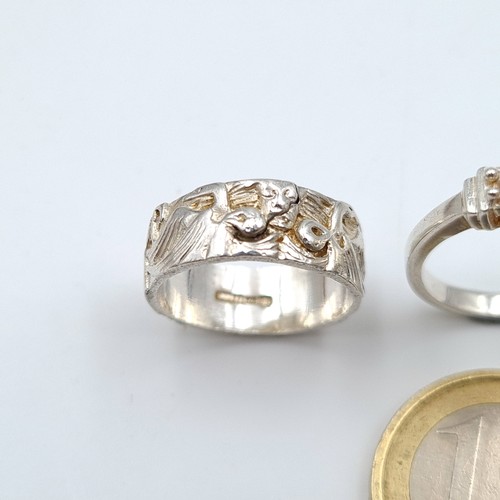 619 - A collection of three sterling silver rings, consisting of a Claddagh style ring. Ring size: L. Toge... 