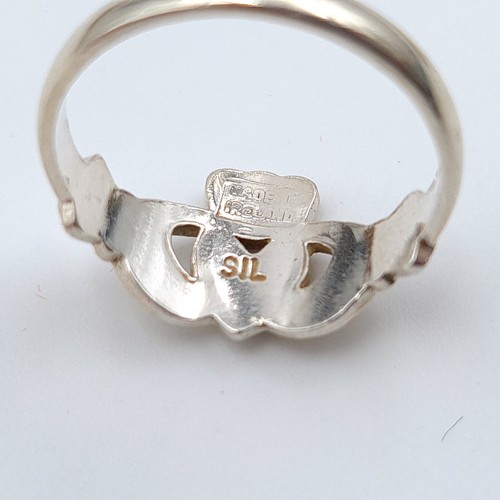 619 - A collection of three sterling silver rings, consisting of a Claddagh style ring. Ring size: L. Toge... 