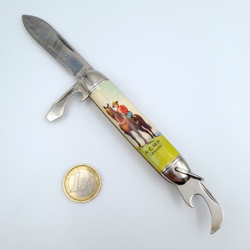 640 - A collection of three items, consisting of a three piece pen knife, set with nicely enamelled exteri... 