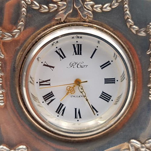 639 - A fine example of a miniature sterling silver Carrs of Sheffield desk clock, featuring a white ename... 