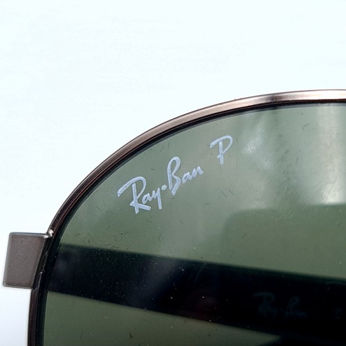 636 - A nice pair of designer aviator Ray-Ban's, set with black metal stems. Lenses in good condition. Enc... 