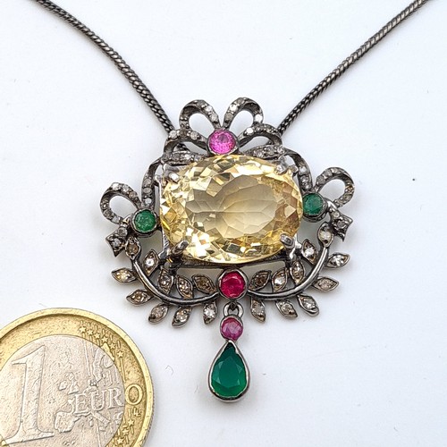 626 - A Citrine sterling silver gem stone pedant, set with Ruby, Emerald and Diamond accents. Comes with G... 