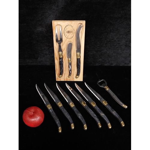 390 - A fine designer  knife set made by Laguiole Inox France including 6 steak knives, a butter knife, a ... 