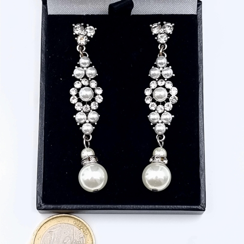 A beautiful pair of pearl and gem stone drop stone earrings, featuring