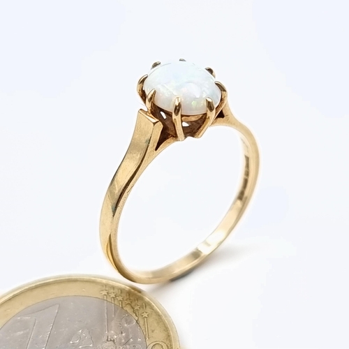 562 - Star lot : A 9 carat gold Australian Fire Opel stone ring, set with a claw mount. Hallmarked 9 carat... 