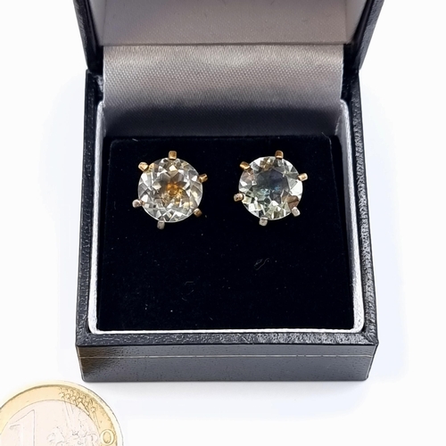 564 - A quality pair of antique Prasiolite facet cut stone stud earrings. Width of stones: 1.1cm.